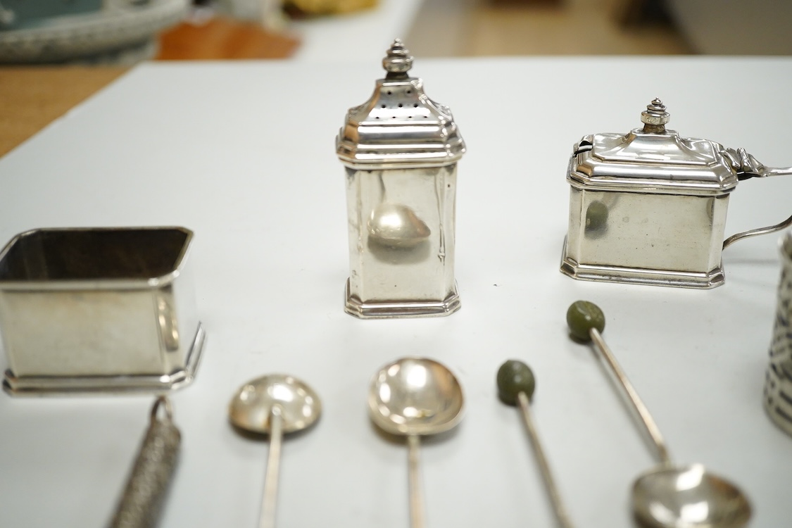 A George V silver three piece condiment set by Mappin & Webb, Birmingham, 1927(two lacking liners), together with one other silver mustard pot, four silver bean end coffee spoons and a white metal propelling pencil.